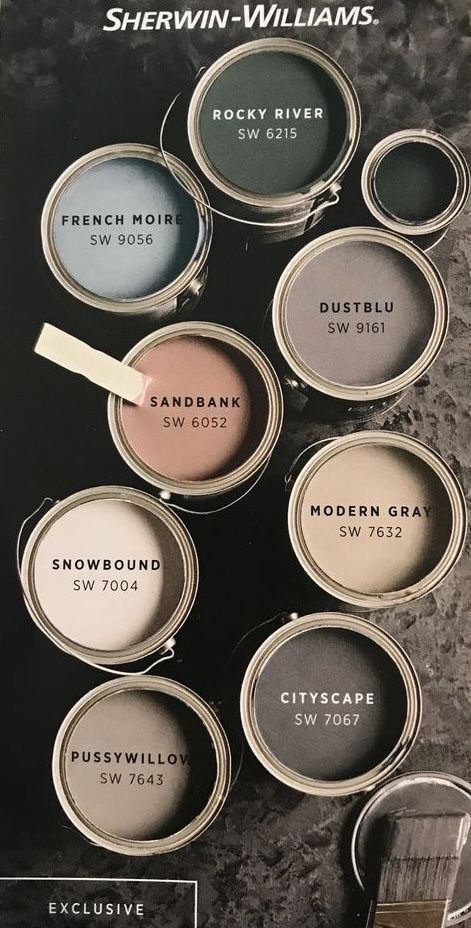 some paint cans with different colors and names on them in the same color palettes