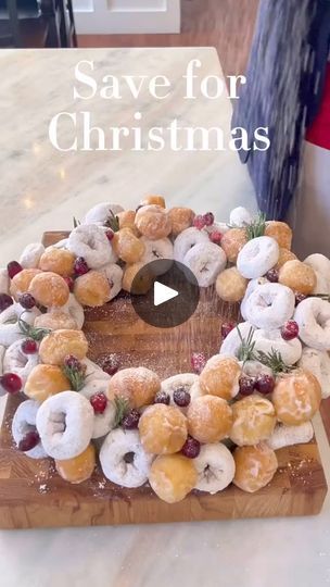 donuts arranged in the shape of a wreath on a cutting board with words saying save for christmas