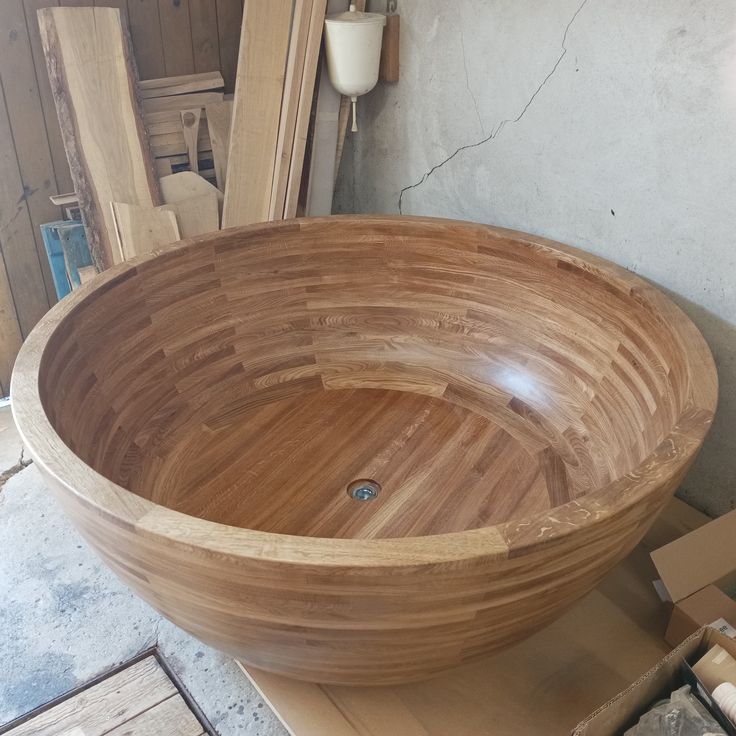 a wooden bowl sitting on top of a table next to other woodworking tools and supplies