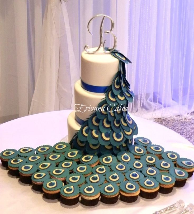 a cake decorated like a peacock on top of a table