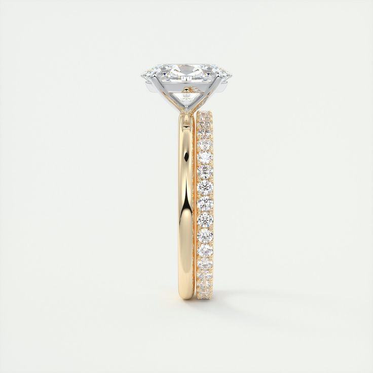 a yellow gold and white diamond engagement ring