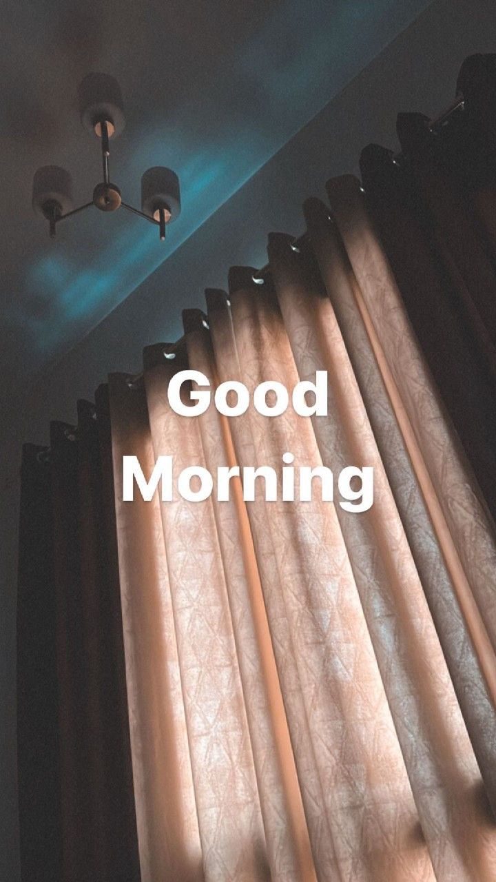 the words good morning are in front of curtains