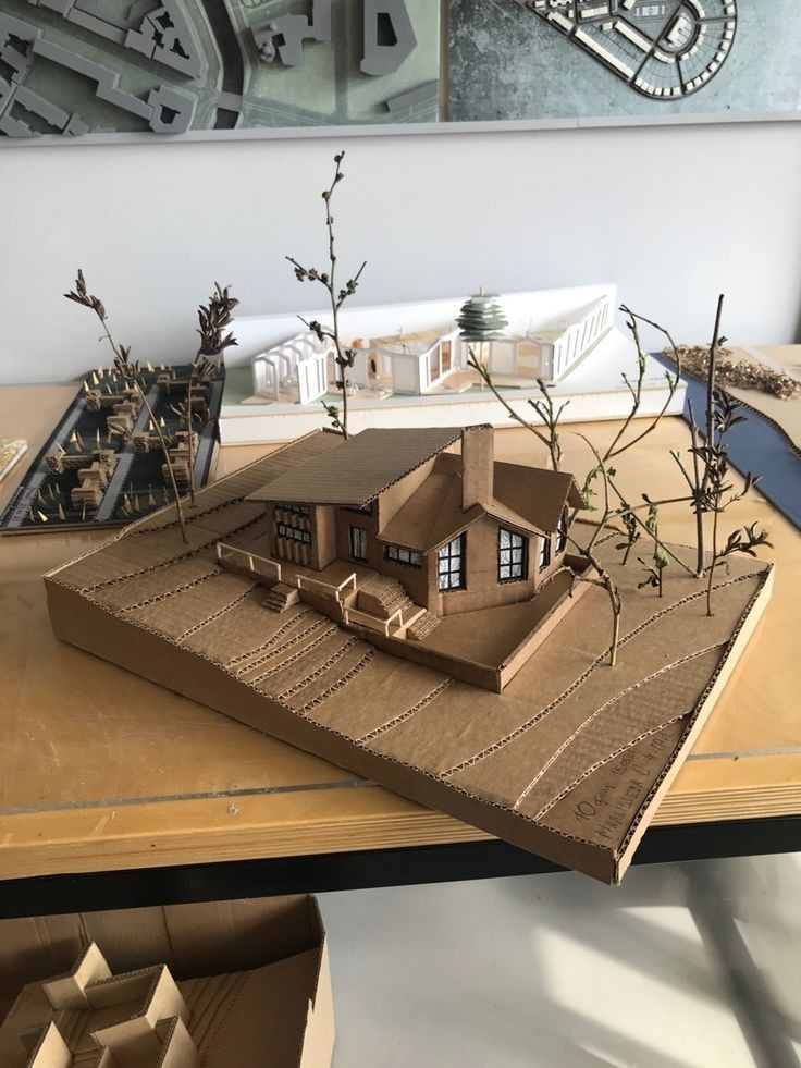 a paper model of a house on a table