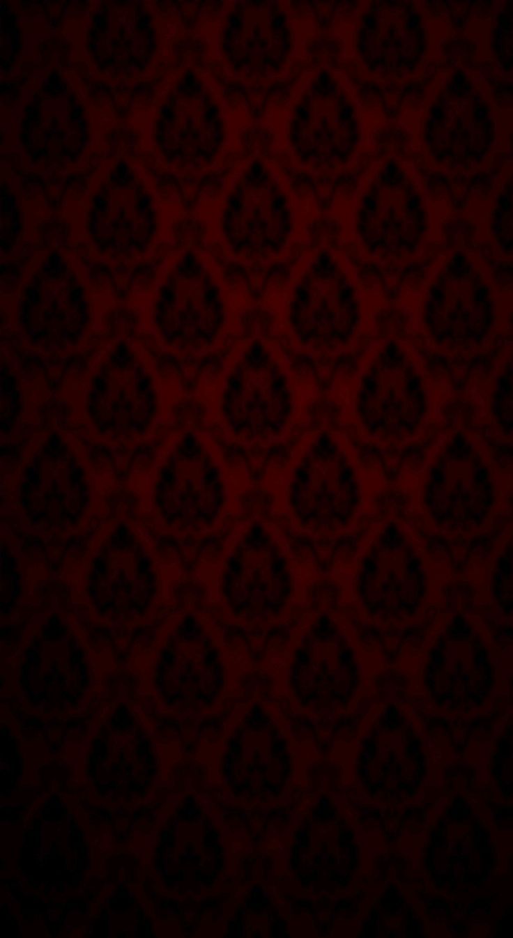 a dark red background with an intricate pattern