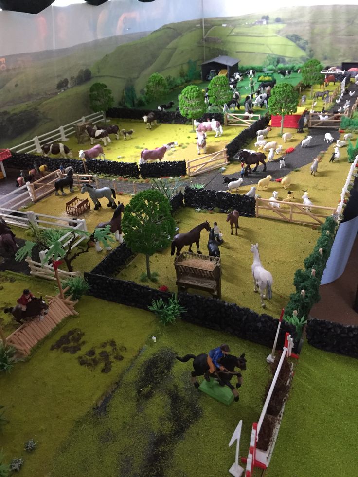 a model farm with horses and other animals