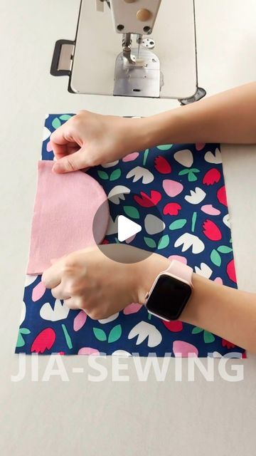 someone using an apple watch to sew