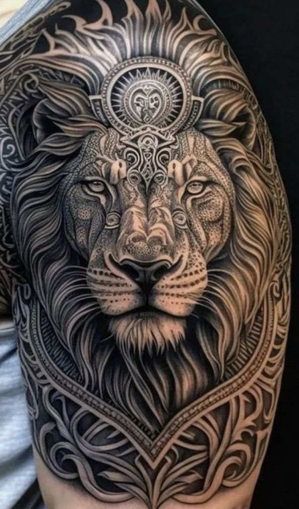 a man's arm with a lion tattoo on it, and an intricate design