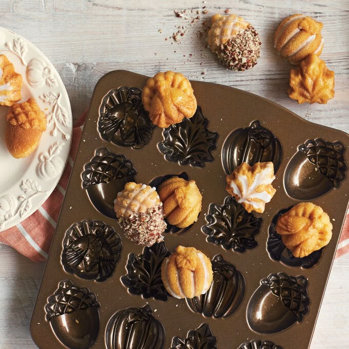 a muffin pan filled with cupcakes on top of a table