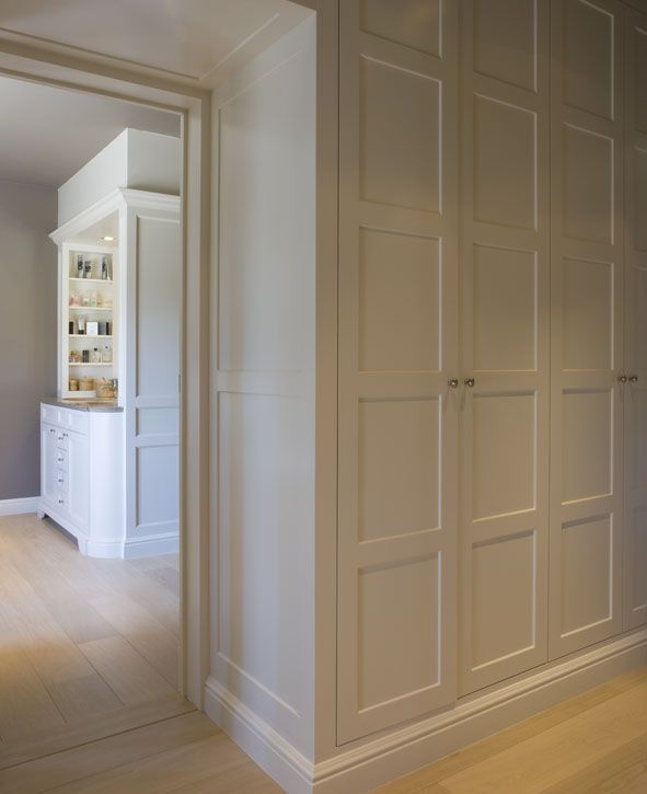 an empty room with white walls and wooden floors