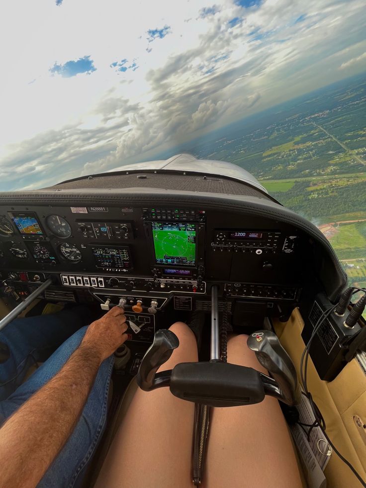 a man sitting in the cockpit of an airplane