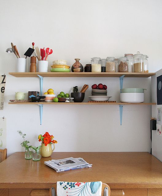 the kitchen is clean and ready for us to use it's shelves are open