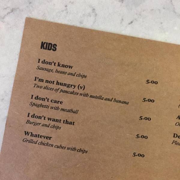 a menu for some kind of food on a table