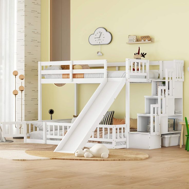 a white bunk bed with a slide next to it in a child's room