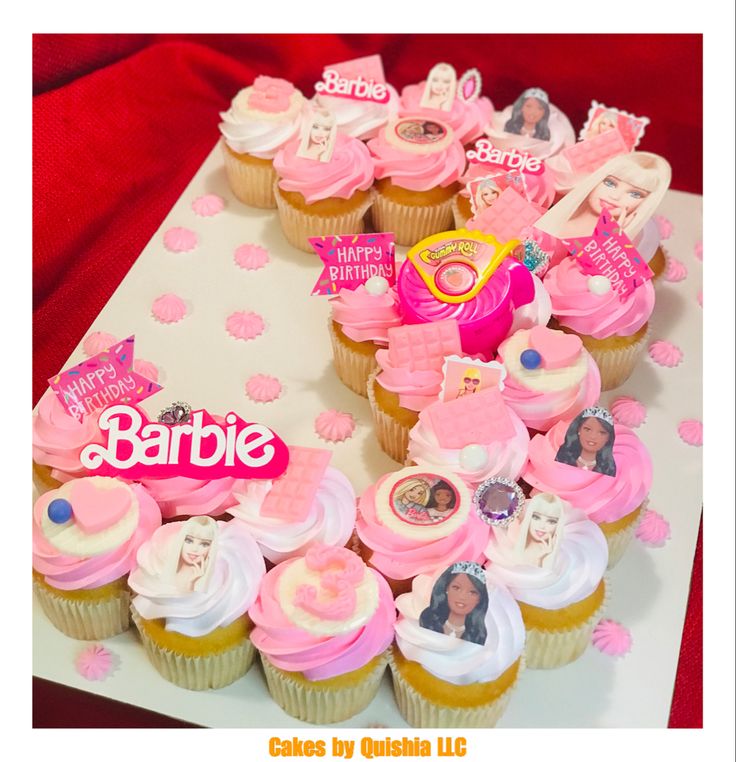 cupcakes with pink frosting are arranged in the shape of a letter b