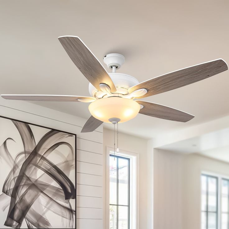 a white ceiling fan in a living room