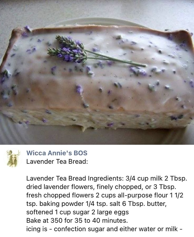 a piece of cake with lavender sprinkles on it is sitting on a plate