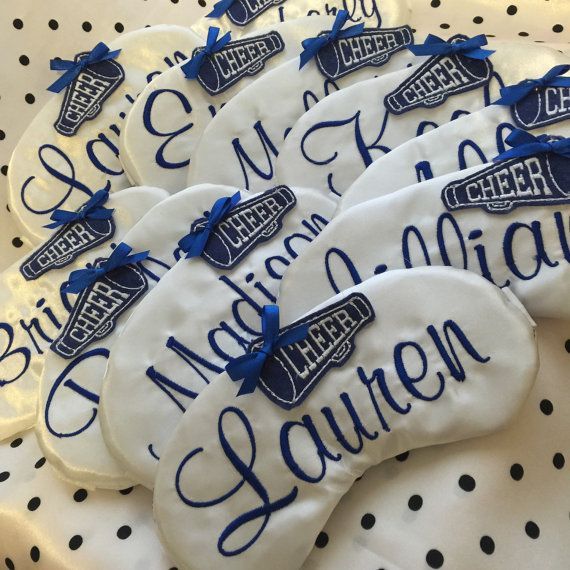 decorated cookies are on a table with polka dots and blue ribbon around the cookie pieces