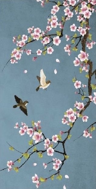 two birds flying in the sky near some pink and white flowers on a tree branch