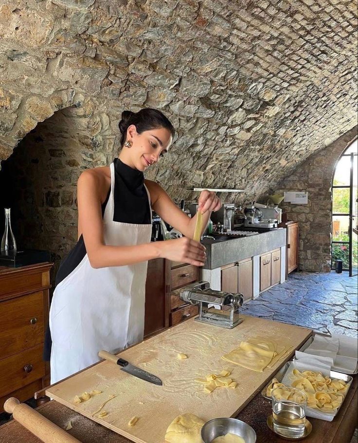 a woman in an apron is making food