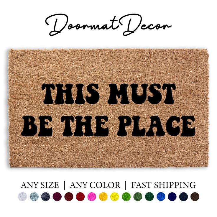 this must be the place door mat with black lettering on it and colors to choose from