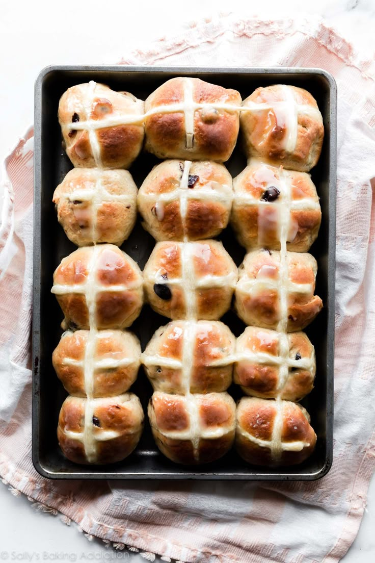 hot cross buns on a baking sheet