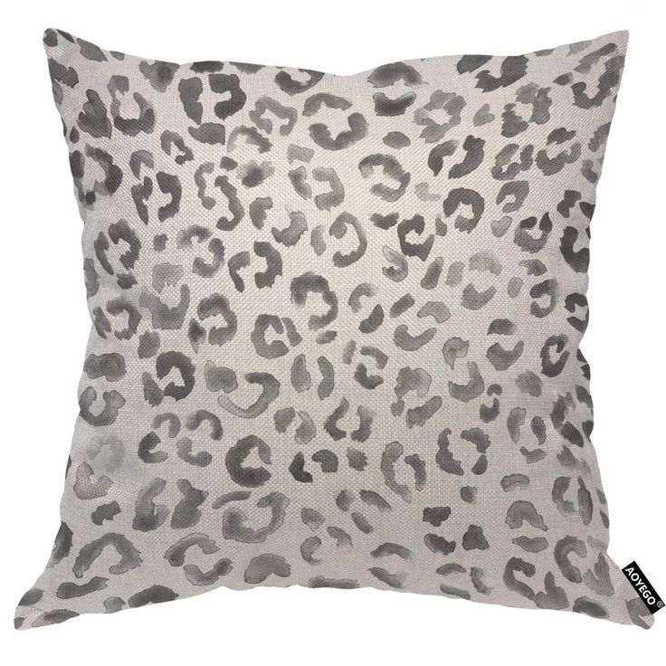 a grey and white leopard print pillow on a white background