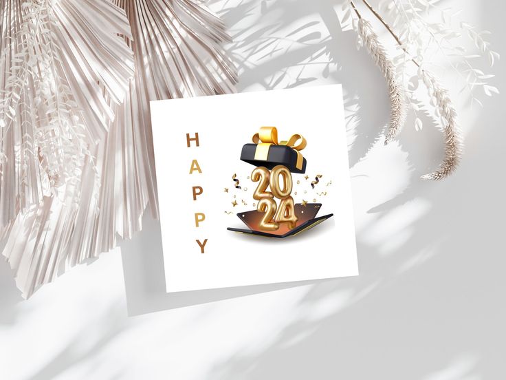 a happy new year greeting card with gold foil numbers and a gift box on top