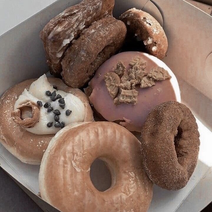 a box filled with lots of different kinds of doughnuts