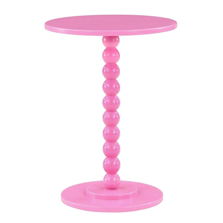 a pink plastic table with three balls on the top and one ball at the base