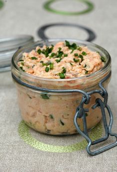 a glass jar filled with food sitting on top of a table