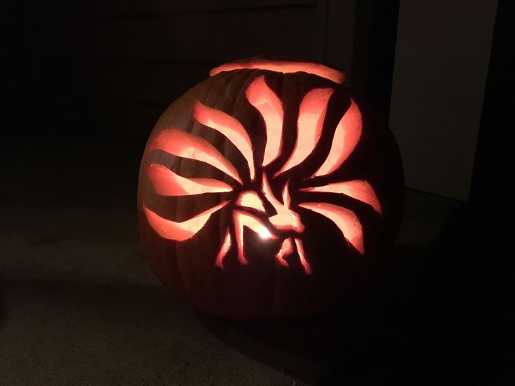 a carved pumpkin sitting on top of a floor