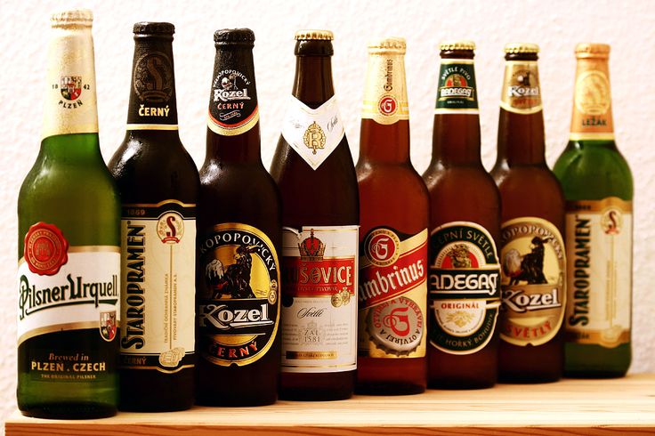 there are many different types of beer on the shelf in front of each other,