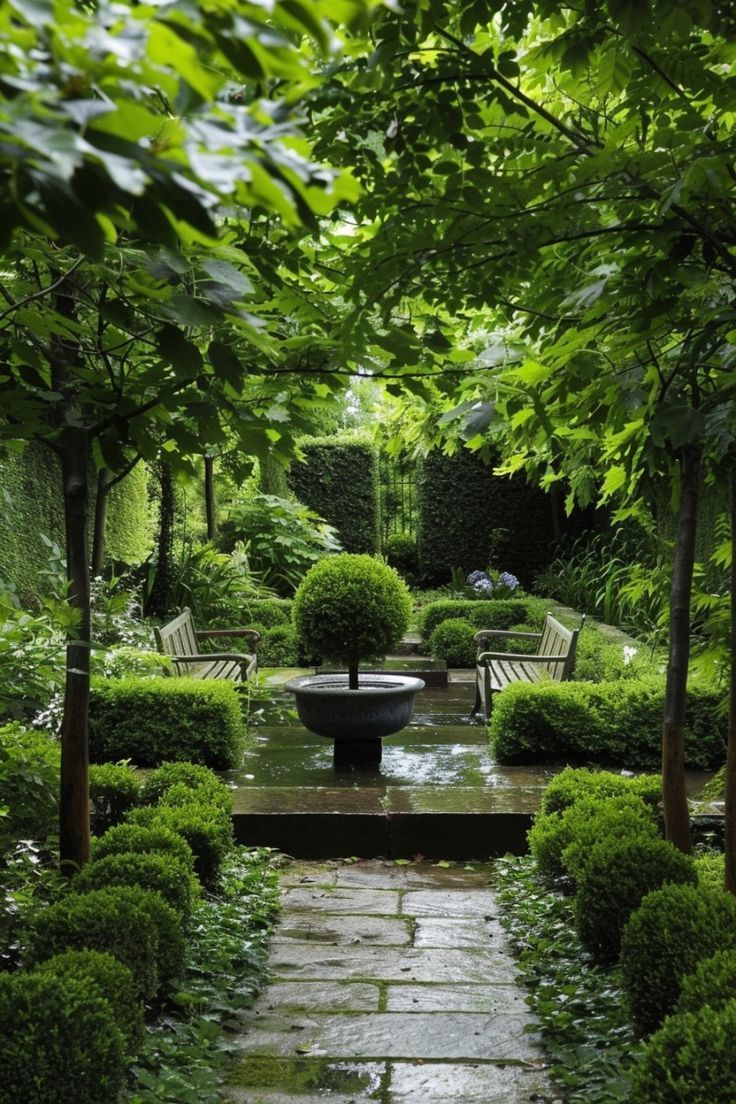 a garden with benches and trees in it