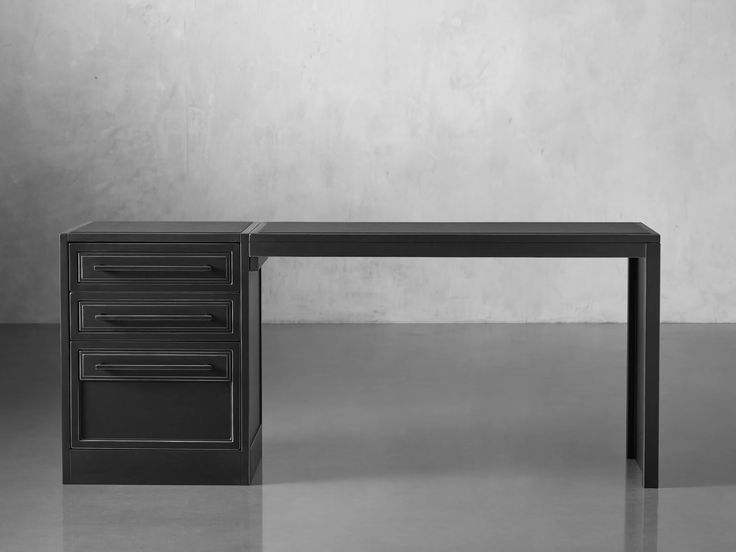 a black desk with three drawers on it