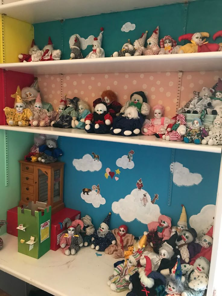 shelves filled with stuffed animals and toys on top of each other in a playroom