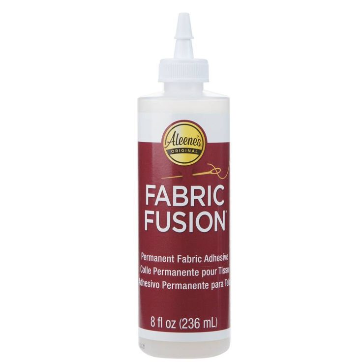 a bottle of fabric fusion on a white background