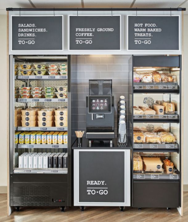 a display case in a grocery store filled with lots of food and drink options for sale