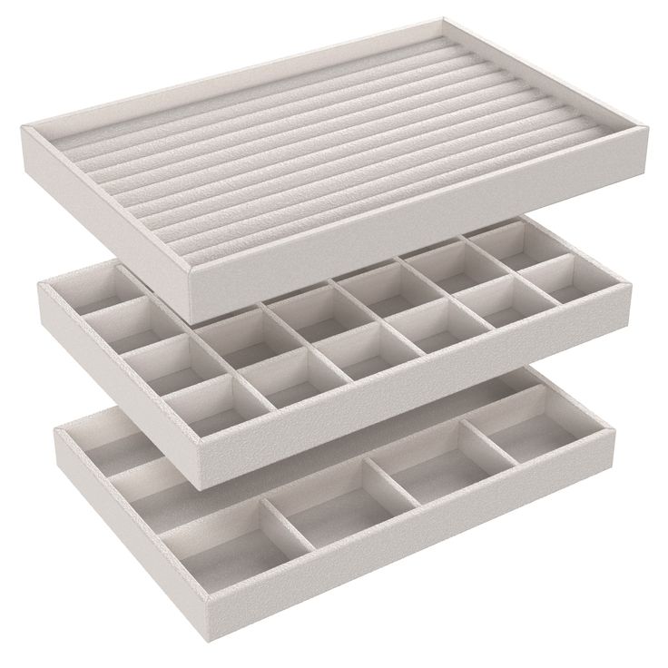 two white trays with dividers are stacked on top of each other in the shape of drawers