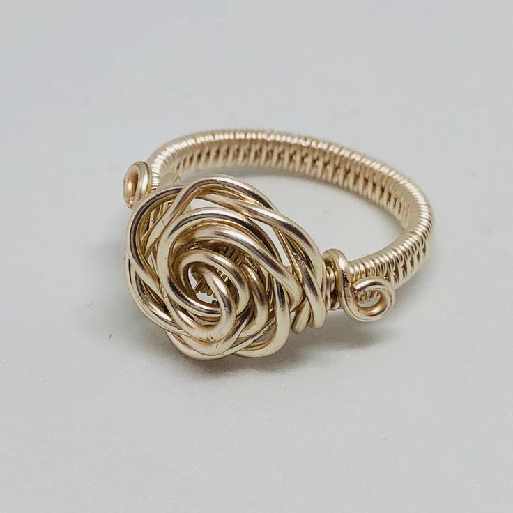 Rose wire wrapped statement ring This piece is hand crafted with silver coloured copper filled wire The wire is non tarnish and will keep its shine These rings are individually made there may have slight alterations  Please feel free to contact me if you have any questions Wire Wrapped Rose Gold Rings, Bohemian Spiral Wire Wrapped Rings, Adjustable Wire Wrapped Rose Gold Ring, Adjustable Rose Gold Wire Wrapped Ring, Adjustable Copper Wire Wrapped Rings, Wire Wrapped Jewelry Rings, Diy Wire Jewelry Rings, Wire Jewelry Patterns, Wire Jewelry Rings