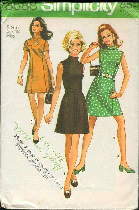 two women in dresses and purses on the cover of a sewing pattern