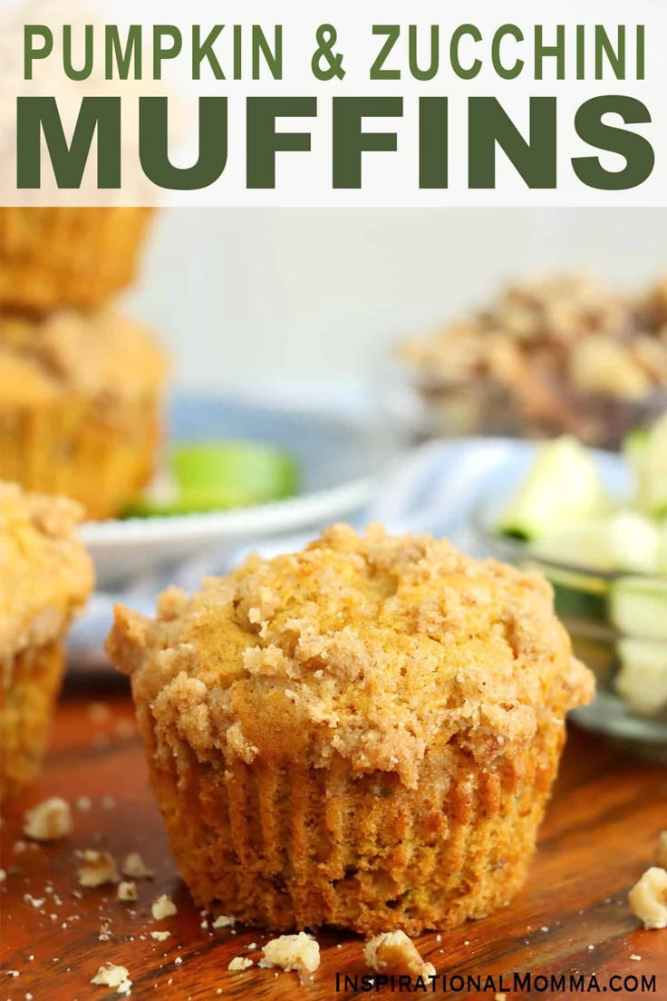 pumpkin and zucchini muffins on a cutting board with apples in the background