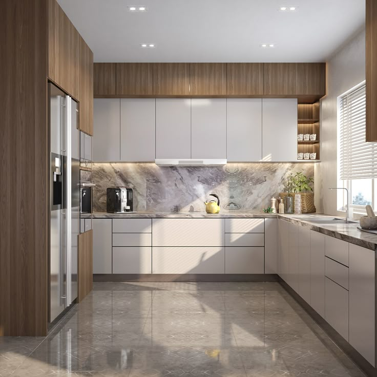 a kitchen with marble counter tops and white cabinets