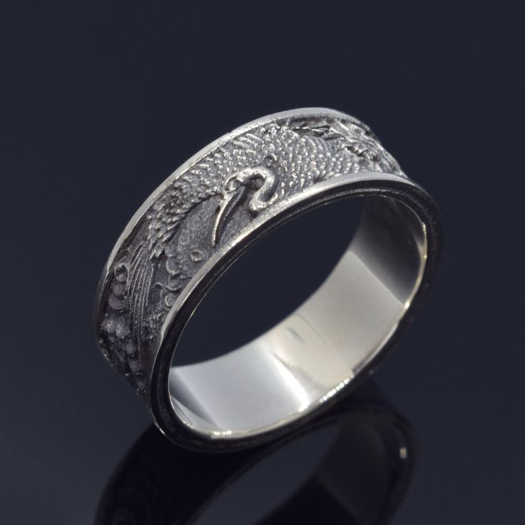 Japanese Crane Ring, Crane and Sun Ring, Japanese Bird Ring, Japanese Traditional Ornamental Ring. ArmenianJewelryHouse personnel do everything to complete the customer's safety and experience.  Item Details  - Material: 925 Sterling Silver - Weight ~ 9.50 Grams(Depending on size) - Gender: Male / Female - Finish: Oxidized Silver / Polished Silver - The product is handmade and its weight may vary up to 1.00 grams. - We recommend using the main photo version of the item(If there are any other opt Unique Engraved Ring With Intricate Design, Traditional Jewelry Ring With Decorative Band, Ceremonial Etched Round Rings, Traditional Round Jewelry With Decorative Band, Etched Sterling Silver Rings For Ceremonial Occasions, Ceremonial Carved Round Ring, Unique Jewelry With Decorative Band As Gift, Unique Decorative Band Jewelry Gift, Unique Jewelry With Decorative Band For Gift