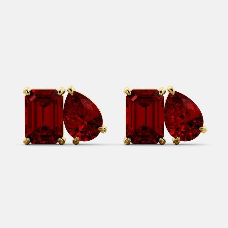 The July Toi et Moi Studs in Ruby. These elegant stud earrings feature a stunning emerald cut Ruby and a pear shape gemstone, set side-by-side in a delicate prong setting. The contrast between the two gemstone shapes is both eye-catching and elegant, making these earrings a perfect choice for any occasion. Features: Ruby gemstone Two-stone design 14K white, yellow or rose gold Fine Quality AA Grade Gems Secure screw-back closure Benefits Gives vitality Inspires determination Helps you understand Gemstone Shapes, Ruby Earring, Rose Stone, Ruby Earrings, Ruby Gemstone, Stone Design, Pear Shape, Luxury Items, Emerald Cut