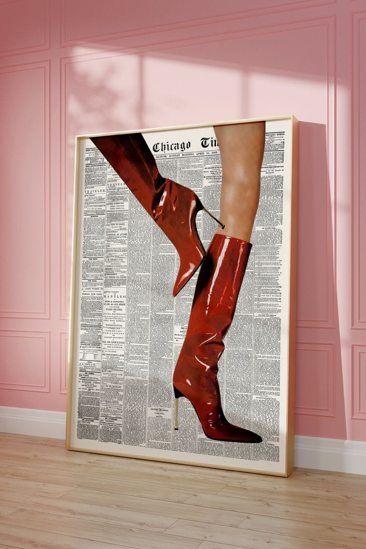 a woman's legs in high heeled red boots on top of a newspaper