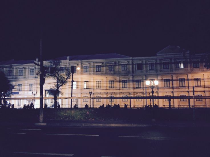 an old building is lit up at night