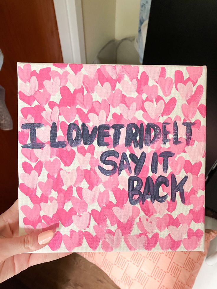 someone is holding up a card that says i lovetride it say it back