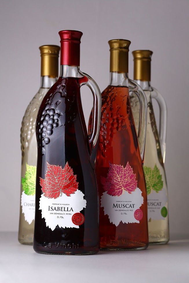 three bottles of wine are sitting next to each other on a table with white background