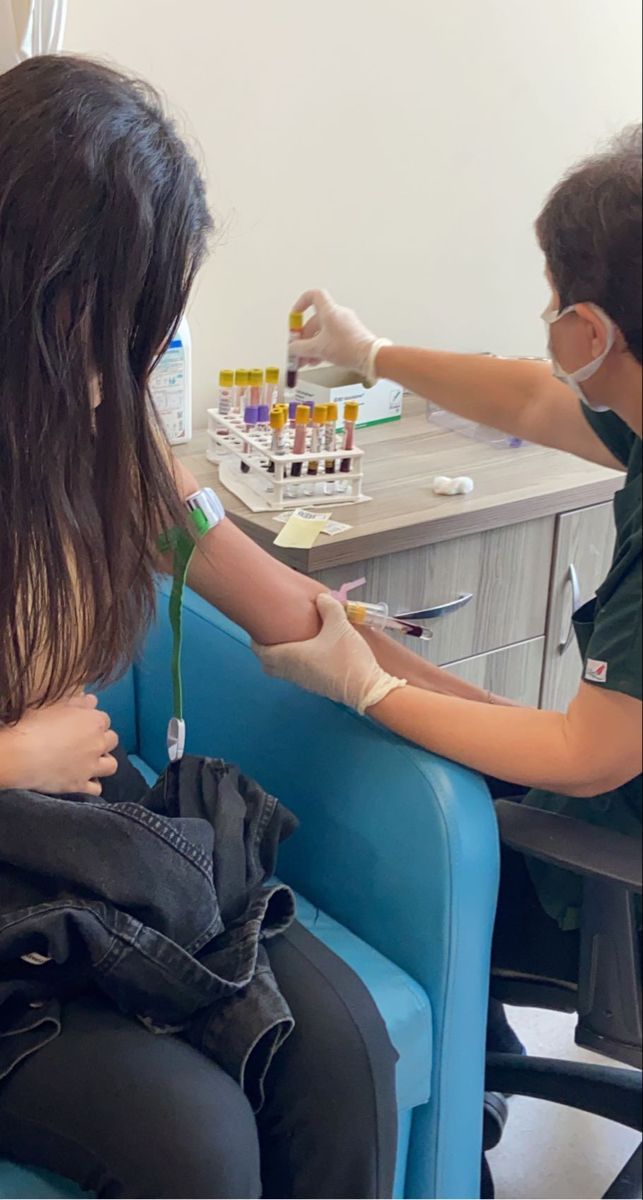 a woman is getting her nails done at the nail salon while another person sits in the chair