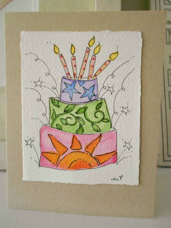 a card with an image of a cake on it's side and candles in the top